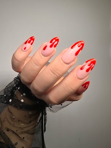 Halloween nails. French manicure with red bloody tips