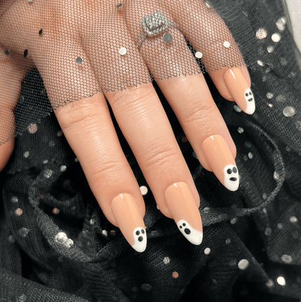 Halloween nails. Nude nails with a ghost design on them