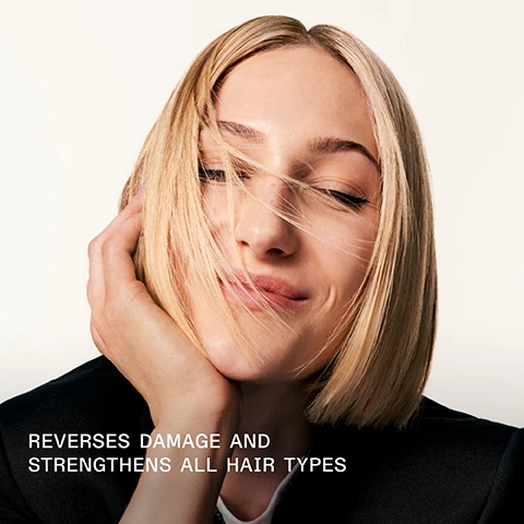 Image 1 - A close-up image of a woman with shoulder-length blonde hair, smiling softly while touching her face, with text at the bottom that reads REVERSES DAMAGE AND STRENGTHENS ALL HAIR TYPES.
Image 2 - A hand holds a bottle of Olaplex No. 3 hair treatment while a strand of hair is twisted around the bottle; the image features the text: REVERSES HAIR DAMAGE IN AS LITTLE AS 3 MINUTES.
Image 3 - Image shows a side-by-side comparison of hair labeled BEFORE on the left with frizzy, unkempt texture and AFTER on the right with smooth, shiny waves, with visible text stating UNRETOUCHED IMAGES and product descriptions below.
Image 4 - A close-up image shows a comparison of hair before and after treatment, with the left side labeled BEFORE displaying frizzy, unkempt hair, and the right side labeled AFTER showing smooth, shiny hair; additional text at the bottom includes details about the results and products used for treatment.
Image 5 - Split image showing hair before and after treatment, with the left side labeled BEFORE displaying frizzy, dull hair, and the right side labeled AFTER showing smooth, shiny hair, accompanied by text at the bottom stating UNRETOUCHED IMAGES and additional product instructions.
Image 6 - Image shows three bottles of Olaplex hair care products: the left bottle is labeled Olaplex Hair Perfector No. 3 for strengthening and repairing hair, and the two right bottles are Olaplex No. 4 Bond Maintenance Shampoo and No. 5 Bond Maintenance Conditioner for hydrating, nourishing, and smoothing hair; there is also a heading that reads Add the Every-Wash Essentials.