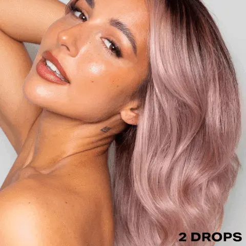 GIF transitioning between two images. Image 1- modelling hair that has used the 'SHRINE Drop It Rose Toner'. Text: 2 drops. Image 2- showing before and after use of the toner. Text: 2 drops