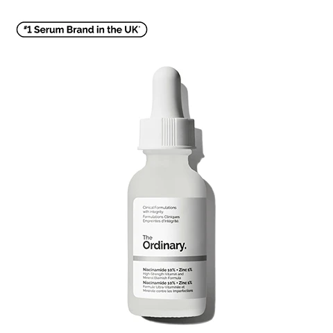 Image 1 - A glass dropper bottle labeled The Ordinary contains a serum, with visible text stating Niacinamide 10% + Zinc 1% and Clinical Formulations with Integrity, alongside the note that it is the number one serum brand in the UK.
Image 2 - A close-up image of a clear liquid with bubbles, alongside text that reads Reduces Pore Visibility and Excess Oil, Improves Signs of Congestion, Instantly Boosts Skin Radiance.
Image 3 - Image showing a comparison of skin before and after treatment, highlighting reduced pore visibility and oiliness, with the words Before and After labeled above each image. Reduces pore visibility and excess oil. Testing on 33 panellists using the product 2x/day.
Image 4 - A person with a beard is applying a clear gel to their cheek, with text overlay listing benefits: Smoothing, Brightening, Reduces Oil.
Image 5 - Image of a dropper with liquid and bubbles, with text that describes key ingredients: Niacinamide 10% (Vitamin B3) supports skin renewal for more radiant smoother skin and Zinc 1% (PCA) balances excess sebum production.
Image 6 - Graphic titled Skin Brightening Hack featuring two bottles labeled The Ordinary with the following details: on the left, a bottle containing Glycolic Acid 7% Exfoliating Toner described as Layer 1 to even tone, and on the right, a bottle labeled Niacinamide 10% + Zinc 1% described as Layer 2 to minimize pore visibility and excess oil, with chemical structure illustrations above each bottle.
Image 7 - Image shows three skincare products from The Ordinary, labeled as Squalane Cleanser, Niacinamide 10% + Zinc 1%, and Natural Moisturizing Factors + HA, along with instructions for use: Prep, Treat, and Seal, and brief descriptions of each products benefits.
Image 8 - Image shows two bottles of The Ordinary Niacinamide serum with droppers, one labeled 30 mL as Standard, Suitable for Travel and the other labeled 60 mL as Bigger, Value Size, with the text Explore 2 Sizes.