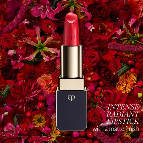 Image 5 - A vibrant red lipstick in a gold and dark blue tube with a gold brand logo sits prominently against a rich, dense backdrop of various red, pink, and orange flowers and berries, with the white text Intense Radiant Lipstick with a matte finish displayed in the lower right. Image 6 - Two lipsticks, one vibrant pink and one deep red, each with a gold base and an embossed brand logo, are displayed against a red background, with the text Vivid Finish, Comfortable Wear, & Moisture at the top and *For all lipsticks except lipstick shimmer 310. at the bottom right.