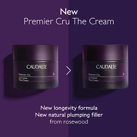 Image 1 - An image showing two similar purple jars of Caudalie Premier Cru The Cream side by side, with the text New Premier Cru The Cream above, an arrow between the jars, and the text New longevity formula New natural plumping filler from rosewood below.
Image 2 - Before and after images showing a forehead; the left side displays noticeable wrinkles, while the right side shows smooth skin, with text stating Forehead wrinkles reduced by 93% and Unretouched results after using Premier Cru The Cream 2X a day for 2 months.
Image 3 - Image shows four different creams on a purple background labeled as The Premier Cru Routine, with the text indicating The Serum at the top, followed by The Cream, The Rich Cream, and The Eye Cream below.
Image 4 - A purple background features a jar of Caudalie Premier Cru cream surrounded by black and green grapes and a dollop of cream, with text highlighting features such as natural plumping filler, longevity patent, and viniferine.
Image 5 - A hand holds a jar of Caudalie Premier Cru La Crème against a backdrop of green leaves, with text stating Longevity patent, 2x more volume after 1 jar*, and additional small print about the creams effects.
Image 6 - Image shows two jars of Caudalie skincare products side by side, labeled The Cream on the left with a black jar and The Rich Cream on the right with a dark purple jar, against a backdrop of creamy texture; bulleted text on the left states wrinkles, dark spots, volume, all skin types, and cream texture, while the right lists wrinkles, dark spots, volume, dry skin, and rich texture.
Image 7 - A woman with long hair is smiling while holding a bunch of dark grapes near her face, with text that reads Targets all signs of ageing followed by checkmarks for Wrinkles, Dark spots, and Volume.
Image 8 - A person is holding a purple jar of Caudalie Premier Cru La Crème with a silver lid, and text reads: Refillable format -89% less packaging*.
Image 9 - A person holds a jar of Premier Cru The Cream, with text instructions on how to recycle it: 1 Keep the glass jar and the lid 2 Recycle the empty refill in the recycling bin 3 Insert a new refill into your jar.