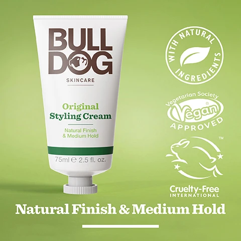 Image 2 - A white tube of Bulldog Skincare Original Styling Cream with a green background, displaying the text BULLDOG SKINCARE Original Styling Cream Natural Finish & Medium Hold 75ml 2.5 fl. oz. along with icons for with natural ingredients, Vegan Approved, and Cruelty-Free International.
Image 3 - An image of creamy shea butter with a light green background and text that reads Shea Butter, Responsibly Sourced Shea Butter, Natural Finish & Medium Hold.
Image 4 - A smiling man with short, curly hair wearing a green shirt is shown against a gray background, with text below him reading All Hair Types.
Image 5 - A white tube of Bulldog Skincare Original Styling Cream with a green cap displays text highlighting its natural finish, medium hold, and shea butter content, set against a light green background, and includes notes that the tube is recycled and made from over 70% plastic from sugarcane.
Image 6 - Four hair styling products from Bulldog Skincare are arranged on a light green background, including a pomade, styling cream, salt spray, and styling clay, with the text Seriously Good Hair Styling displayed below the products.