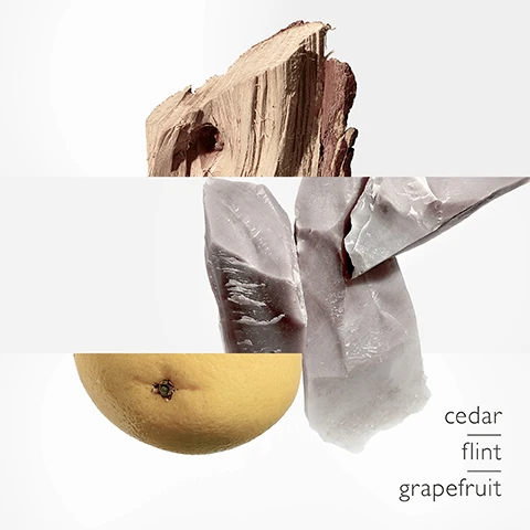 Image 1 - A piece of raw wood, several light grey rock fragments, and half a grapefruit are displayed against a white background, with the text cedar flint grapefruit listed vertically, with cedar and flint underlined. Image 2 - Stacked pieces of light brown wood, some showing textured bark and others revealing the inner wood grain, against a plain background, with the word cedar written in the top left corner. Image 3 - A grapefruit is shown deconstructed into three horizontal sections with a white background, and the word grapefruit is written in the top right corner. Image 4 - A vertical composition of multiple pieces of rough, light grey-pink flint rock against a white background, with the text flint underlined in the top left. Image 5 - Five rectangular Terre DHermès perfume bottles with clear glass and varying liquid colors, each with a black or silver cap, are displayed on individual white square pedestals against a white background, with text on the bottles reading TERRE DHERMÈS, TERRE DHERMÈS EAU GIVRÉE, TERRE DHERMÈS EAU DE PARFUM INTENSE, TERRE DHERMÈS EAU INTENSE VÉTIVER, and TERRE DHERMÈS, and text below each bottle describing the product and its notes as follows: TERRE DHERMÈS EAU DE TOILETTE grapefruit cedar flint, TERRE DHERMÈS EAU GIVRÉE cedrat juniper berry Timut pepper, TERRE DHERMÈS EAU DE PARFUM INTENSE lively bergamot warm wood intense lava stone, TERRE DHERMÈS EAU INTENSE VÉTIVER green bergamot Sichuan pepper vetiver, and TERRE DHERMÈS PARFUM grapefruit cedar shiso.