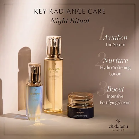 Image 1 - Image of three skincare products from Clé de Peau Beauté arranged on a light surface, including a serum, a hydro-softening lotion, and an intensive fortifying cream, with the text KEY RADIANCE CARE Night Ritual and numbered steps for usage: 1 Awaken The Serum, 2 Nurture Hydro-Softening Lotion, 3 Boost Intensive Fortifying Cream.