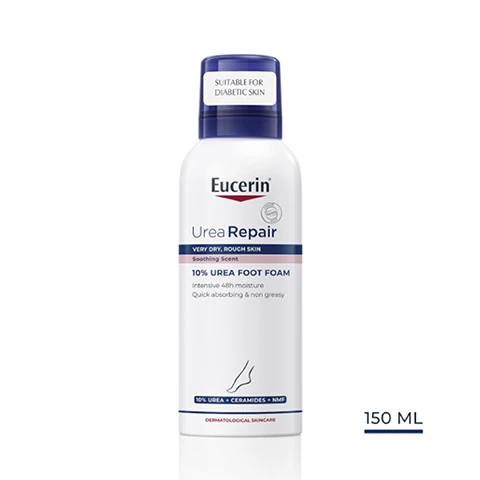 Image 1 - A bottle of Eucerin Urea Repair 10% Urea Foot Foam, labeled as suitable for diabetic skin, with a white background and visible text indicating 150 ML.
Image 2 - Image of a hand applying cream to a foot, with text that reads Key Benefits, Intensive 48h moisture, Quick absorbing & non greasy, With soothing scent.
Image 3 - A hand holding a bottle of Eucrin Urea Repair foot foam, with text on the side stating Dry, rough skin, Moisturising, and For feet.
Image 4 - A dollop of white cream is shown with labels pointing to key ingredients: 10% Urea, Ceramides, and Natural Moisturisers.
Image 5 - A blue background with rays of light features the text Consumers confirm Moisturises and relieves very dry skin, along with a small note at the bottom about a product in use study involving 172 women with dry skin.
Image 6 - Image shows three Eucerin Urea Repair products arranged sequentially with the labels indicating a recommended skincare routine: left is a shower gel, center is a 10% lotion, and right is a foot foam, along with the title Recommended Routine and numbers 1, 2, and 3 above each product.