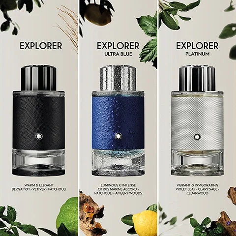 Image 5 - Three Montblanc Explorer perfume bottles, black, blue, and silver, stand side-by-side surrounded by green leaves, citrus fruits, and wood, with text that reads: EXPLORER WARM & ELEGANT BERGAMOT - VETIVER - PATCHOULI EXPLORER ULTRA BLUE LUMINOUS & INTENSE CITRUS MARINE ACCORD - PATCHOULI - AMBERY WOODS EXPLORER PLATINUM VIBRANT & INVIGORATING VIOLET LEAF - CLARY SAGE - CEDARWOOD.