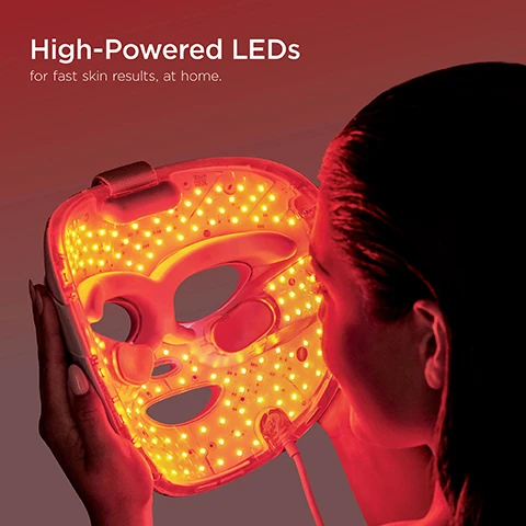 Image 1 - A person holds a red LED facial mask that illuminates their face, with visible text reading High-Powered LEDs for fast skin results, at home.
Image 10 - A smiling man with braided hair applies under-eye patches while gently touching his face, with the text Under-Eye Revive and Helps firm, tighten and soothe under-eyes visible alongside a circular graphic of a face with eye patches on it.
Image 2 - Close-up of a persons face with blue light patterns around the under-eye area, featuring visible text that reads 5 MIN Under-Eye Cooling Helps depuff under-eyes in minutes.
Image 3 - A woman with long, light-colored hair is holding a black facial device emitting a red light while looking calmly to the side, with text that reads 6 MIN Better Ageing Red LEDs and Infrared helps reduce the appearance of fine lines, and wrinkles. Full results after 8 weeks.
Image 4 - A person with short, light-colored hair is using a LED facial mask, with a caption that reads Blemish Repair Red + Blue LEDs and Infrared helps reduce the appearance of textured, uneven skin and blemishes. 8 MIN Full results after 8 weeks.
Image 5 - A woman with braided hair holds a high-tech facial mask emitting pink light against a gradient background, with text that reads 4 MIN, Skin Sustain, Red + Blue LEDs and Infrared helps boost brightness and maintains skin complexion. After an 8 week cycle of either Better Ageing or Blemish Repair.
Image 6 - A diverse group of seven individuals of various skin tones and hair types poses together against a gradient background, with the text Safe and effective Every skin type. Any skin tone. displayed above them and a skincare type selection labeled DRY • OILY • NORMAL • COMBINATION • SENSITIVE at the bottom.
Image 7 - A hand holds the Shark CryoGlow Remote, which features an LCD display showing treatment options, a power/select dial, a back button, and notes on battery life and adjustable chill levels, with text indicating a charging port for USB-C chargers.
Image 8 - An infographic demonstrating three wavelengths of skin penetration, featuring sections labeled Better Ageing Mode, Blemish Repair, and Skin Sustain Mode with visual representations of red (630nm) and blue (415nm) LEDs, and infrared (830nm) targeting different skin layers, including the epidermis and dermis.
Image 9 - A man and a woman stand back to back, with the woman holding a facial mask, accompanied by text that reads One size fits all. Designed to fit all face shapes and sizes, for full and even skin care treatment.