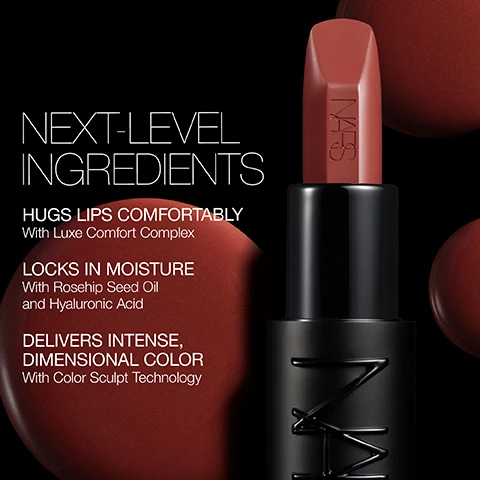 Image 1 - A close-up of a lipstick tube displaying a reddish-brown shade, with text outlining its features: NEXT-LEVEL INGREDIENTS, HUGS LIPS COMFORTABLY With Luxe Comfort Complex, LOCKS IN MOISTURE With Rosehip Seed Oil and Hyaluronic Acid, DELIVERS INTENSE, DIMENSIONAL COLOR With Color Sculpt Technology.
Image 2 - A woman with a bold red lip color holds a lipstick product while looking confidently at the camera, with overlay text that includes statistics about the lipsticks texture and application: UNDENIABLE BENEFITS, IRRESISTIBLE RESULTS. 100% agree it feels soft and creamy* 100% agree it provides a smooth application* 96% agree it feels nourishing and hydrating* *Based on a U.S. consumer perception study of 31 subjects.
Image 3 - Image shows three different lipstick options with lips painted in various shades of red: Explicit Lipstick is a dimensional satin finish with medium-to-full coverage and long-lasting comfort; Powermatte Lipstick has a matte finish, full coverage, and bold color lasting for hours; Afterglow Sensual Shine Lipstick features a high-shine finish, sheer-to-medium coverage, and a color-meets-care hybrid benefit. The text at the top reads PICK YOUR LIPSTICK.