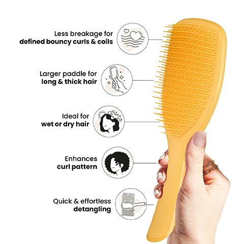 Image 1 - A person holding a yellow paddle brush is shown with icons and text describing its features: less breakage for defined bouncy curls and coils, larger paddle for long and thick hair, ideal for wet or dry hair, enhances curl pattern, and quick and effortless detangling.
Image 2 - A woman with curly hair smiles while holding a yellow hairbrush, and the text reads Firm-flex teeth for curly to coily hair.
Image 3 - Image shows a side-by-side comparison of curly hair labeled Before on the left and After on the right, featuring curly hair that appears smoother, with text stating 83% agree it easily removes knots and tangles and 81% agree it glided through their curls and coils, along with a note below indicating a survey of 102 UK respondents aged 16-45 testing after 2 weeks in 2020.
Image 4 - Image shows three hairbrushes labeled as Mini, Regular, and Large with measurements for each: Mini is 6.1 inches by 2.1 inches, Regular is 8.7 inches by 2.6 inches, and Large is 9.3 inches by 3.1 inches, along with recommended hair types for each size and a note on the Large brush that says for larger daily detangling.