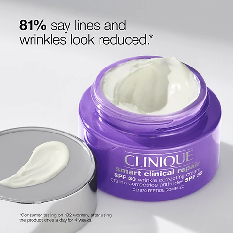 Image 1 - A jar of Clinique Smart Clinical Repair SPF 30 wrinkle correcting cream with its lid off, showing a creamy texture, accompanied by the text 81% say lines and wrinkles look reduced.* *Consumer testing on 132 women, after using the product once a day for 4 weeks.
Image 2 - A close-up of a smiling woman with a light application of white sunscreen on her cheek, showing a healthy, glowing complexion, accompanied by the text SPF that looks invisible on skin. Get a lightweight, non-greasy finish with no white cast.