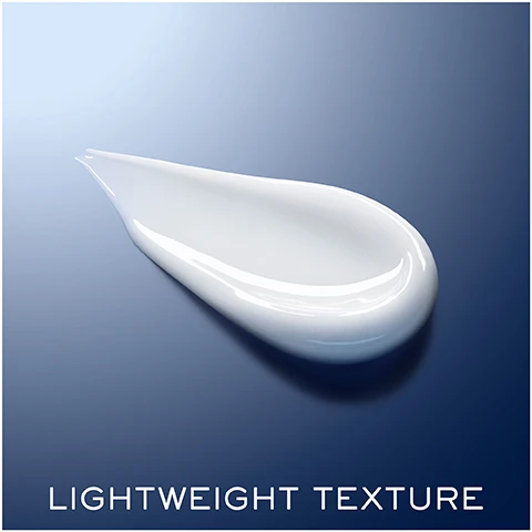 Image 1 - An illustration of a droplet of creamy white product on a smooth blue background with visible text that reads LIGHTWEIGHT TEXTURE.
Image 2 - A woman applies a skin treatment under her right eye, with a smooth background and text indicating -33% dark circles, +23% smoothness, and -21% eye wrinkles.