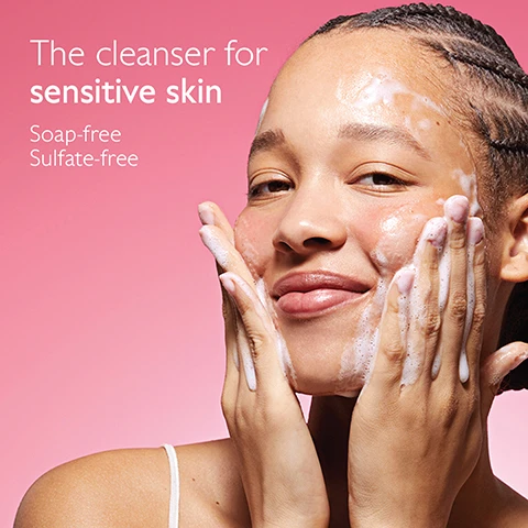 Image 1 - A young woman with braided hair smiles while washing her face with a white foamy cleanser against a pink background, with text that reads The cleanser for sensitive skin Soap-free Sulfate-free. Image 2 - A person with short blonde hair and glowing skin applies a white cream from a pink tube of VinoHydra Crème Sorbet Hydratante to their cheek, alongside text that reads: Normal skin, even sensitive. 90% saw soothed skin*. 70% saw skin less prone to redness**. *Clinical study. % of satisfaction. 22 volunteers. 28 days. **Redness due to skin dryness.