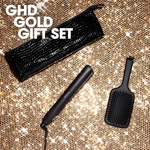 Image 1 - A black ghd gold hair straightener, a black ghd paddle brush, and a black crocodile-patterned zippered pouch are arranged on a sparkling gold background, with the visible text GHD GOLD GIFT SET, ghd gold, and ghd. Image 2 - A black ghd hair straightener with a cord, a black ghd paddle brush, and a black crocodile-embossed heat-proof bag with a gold zipper and three small gold studs are displayed on a white background, along with the text WHATS INSIDE: ghd Gold Hair Straightener, ghd Paddle Brush & Heat-Proof Bag. Image 3 - A woman with blonde wavy hair, red lipstick, and a black sequined top holds a black ghd hair straightener in one hand and a black crocodile-textured pouch in the other, with a black hairbrush on a glittery gold surface in front of purple boxes, against a red checkered background, with the text INSTANTLY SLEEKER, SMOOTHER HAIR. Image 4 - A woman with blonde wavy hair and red lipstick, wearing a black sequined top, holds a black crocodile clutch, a black paddle brush, and a black hair straightener; text reads FIVE-STAR HAIR GIFTS. Image 5 - A blonde woman with red lipstick and a black sequin top holds a ghd hair straightener above her head, looking at the camera, against a red background with ghd logos, and white text that reads Perfect for sleek & smooth results suitable for all hair types. Image 6 - A ghd hair styling set features a black hair straightener, a black crocodile-embossed heat-resistant mat with a gold zipper, and a black paddle brush, alongside a glittery maroon circle overlay that reads INCLUDES BAG & BRUSH WORTH £65.