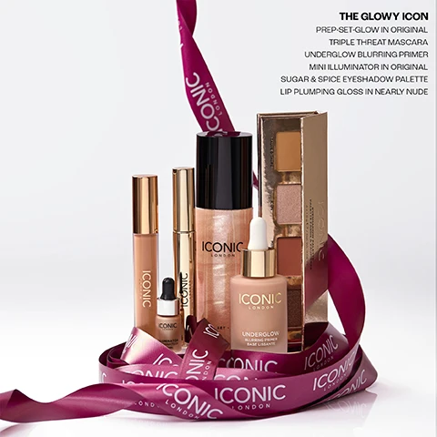 Image 1 - Six Iconic London beauty products, including a spray bottle, two dropper bottles, two tubes, and an eyeshadow palette, are displayed on a white surface, encircled by a purple ribbon that reads ICONIC LONDON, and visible text on the products includes UNDERGLOW BLURRING PRIMER on one dropper and ILLUMINATOR on another, with further text on the right side of the image stating THE GLOWY ICON PREP-SET-GLOW IN ORIGINAL TRIPLE THREAT MASCARA UNDERGLOW BLURRING PRIMER MINI ILLUMINATOR IN ORIGINAL SUGAR & SPICE EYESHADOW PALETTE LIP PLUMPING GLOSS IN NEARLY NUDE. Image 2 - A woman with long dark hair and dramatic eye makeup holds a gold mascara tube in her left hand, with text visible on the image reading THE GLOWY ICON TRIPLE THREAT MASCARA. Image 3 - The image displays The GLOWY ICON, a collection of Iconic London beauty products: a small gold dropper bottle of Iconic London Illuminator, a gold Iconic London Triple Threat Mascara tube described as our best selling trending mascara, an Iconic London eyeshadow palette showing shades Velvet Crush, Merlot Mondays, Moon, and Taupe Djour, a rose gold Iconic London lip gloss, a pink shimmer spray bottle of Iconic London Prep Set Glow described as our best selling viral prep and setting mist, and a frosted dropper bottle of Iconic London Underglow Blurring Primer Base Lumineuse described as a fan favorite, sell out primer. Image 4 - The image displays four customer reviews for beauty products, each with five stars, against a red curtain background. The reviews are: TRIPLE THREAT MASCARA: My favourite mascara, no clumping and makes my lashes look long, easy to remove. Like it so much brought as gifts! Claire C. UNDERGLOW BLURRING PRIMER: Smooths out my skin so beautifully, blurs imperfections, and creates the perfect base that makes my makeup last all day. Emily. ILLUMINATOR IN ORGINAL: I use this with matte foundation. Gives me a bit of illumination. I’ve received compliments on how healthy my skin looks. Stacey. PREP - SET - GLOW: I have been buying this product for 5 years now. Not only does it smell lovely but it works so well and really makes my make up look good afterwards. Would definitely recommend it! Sam. Image 5 - The image displays a collage of cosmetic products, featuring five shimmering drops of liquid illuminator with the text ILLUMINATOR SHADE ORIGINAL, black mascara brush strokes labeled TRIPLE THREAT MASCARA VOLUMISES LENGTHS LIFTS, three powdered makeup swatches named ICON, MERLOT MONDAYS, and TAUPE DTAUPE, and a glossy nude lip plumping gloss swatch with the text LIP PLUMPING GLOSS SHADE NEARLY NUDE. Image 6 - The image displays two liquid cosmetic textures side by side, with a shimmery rose-gold liquid on the left and a lighter beige streaked liquid on the right, accompanied by descriptive text. Text on the left reads PREP-SET-GLOW Cucumber Extract Chamomile Mica. Text on the right reads UNDERGLOW BLURRING PRIMER Soft Focus Blurring Powders Vitamin C Natural Looking Glow.