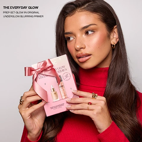 Image 2 - A woman with long dark hair wearing a red turtleneck sweater and gold rings holds a pink gift box containing two Iconic London beauty products, tied with a pink ribbon, with visible text reading THE EVERYDAY GLOW PREP-SET-GLOW IN ORIGINAL UNDERGLOW BLURRING PRIMER, ICONIC LONDON, 27 ml e / 0.91 fl.oz. Image 3 - Two makeup primer bottles, one taller with a black cap and shimmery peachy liquid, and one shorter frosted bottle with a dropper containing matte peachy liquid, are intertwined with a pink ribbon printed with ICONIC LONDON text. The image also displays the text THE EVERYDAY GLOW PREP-SET-GLOW IN ORIGINAL UNDERGLOW BLURRING PRIMER, on the taller bottle ICONIC LONDON PREP - SET - GLOW, and on the frosted bottle ICONIC LONDON UNDERGLOW BLURRING PRIMER BASE LISSANTE. Image 4 - Two shimmering peachy-pink beauty product bottles are displayed against a white background, a shorter dropper bottle on the left and a taller spray bottle with a black cap on the right, with visible text reading: The EVERYDAY GLOW, UNDERGLOW BLURRING PRIMER, FAN FAVORITE, SELL OUT PRIMER, ICONIC LONDON UNDERGLOW BLURRING PRIMER BASE LISSANTE, PREP SET GLOW, OUR BEST SELLING VIRAL PREP AND SETTING MIST, and ICONIC LONDON PREP - SET - GLOW. Image 5 - Four customer review cards, each with five stars, are displayed against a red velvet curtain background, reading: UNDERGLOW BLURRING PRIMER This smooths my skin instantly, blurs out imperfections, and gives the most flawless base for makeup it makes everything apply so much better! Lucy; PREP - SET - GLOW This is the perfect setting spray – it hydrates, keeps my makeup in place all day, and leaves the most gorgeous radiant glow. Lisa H.; UNDERGLOW BLURRING PRIMER So smooth to put on my face, its like silk. It really gives radiance to my skin and a perfect base. I love it so have ordered more! Annie; and PREP - SET - GLOW I have been buying this product for 5 years now. Not only does it smell lovely but it works so well and really makes my make up look good afterwards. Would definitely recommend it! Sam. Image 6 - A split image showing two shimmery liquid cosmetic swatches: the left, a peachy-pink shade, displays the text PREP-SET-GLOW, CUCUMBER EXTRACT✔️, CHAMOMILE ✔️, MICA ✔️, and the right, a lighter beige shade, displays the text UNDERGLOW BLURRING PRIMER, ✔️ SOFT FOCUS BLURRING POWDERS, ✔️ VITAMIN C, ✔️ NATURAL LOOKING GLOW.